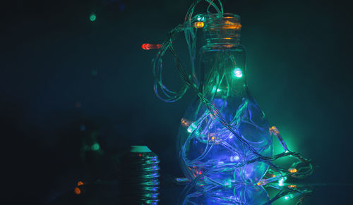 Close-up of illuminated lights at night