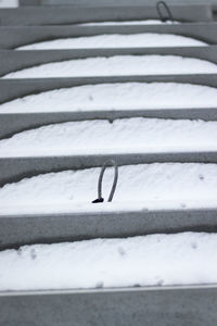 High angle view of snow on bed