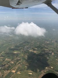 Aerial view of landscape seen through airplane window