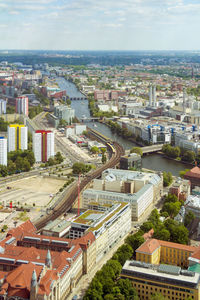 High angle view of buildings in city against sky