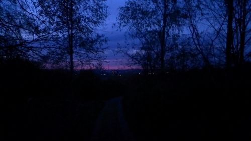 Scenic view of landscape against sky at dusk