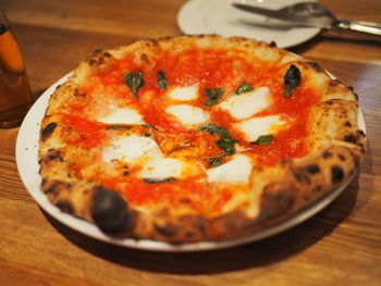 Close-up of pizza served on table