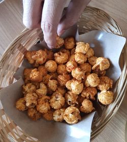 Cropped hand of person holding food