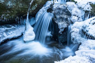 Scenic view of icy  waterfall