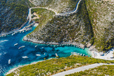 Aerial view of porto vromi with many fisher boats in the blue bay. zakynthos - zante island, greece