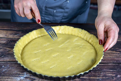 Women preparing delicious apple tart or pie large  on wood table background.