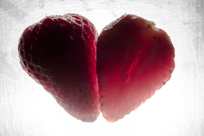 Close-up of strawberry over white background