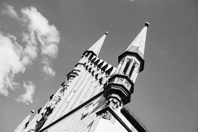 Low angle view of cross against sky