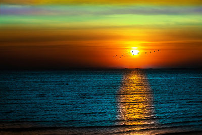 Scenic view of sea against sky during sunset