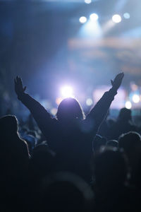 Silhouette people at music concert