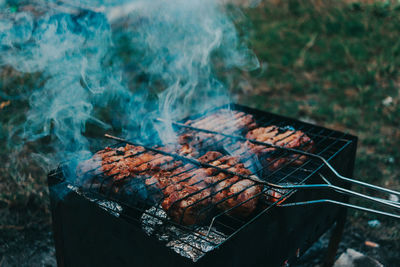 Close-up of meat on barbecue grill