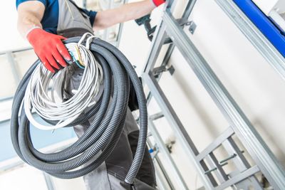 Low angle view of man working on metal