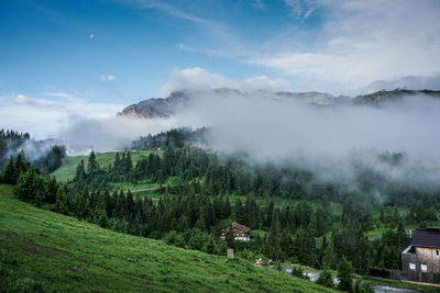 Scenic view of mountain cloudy landscape against clear sky.