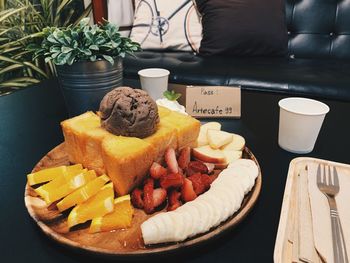 Close-up of fruits in plate on table