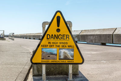 Warning sign on road