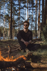 Portrait of young man in forest