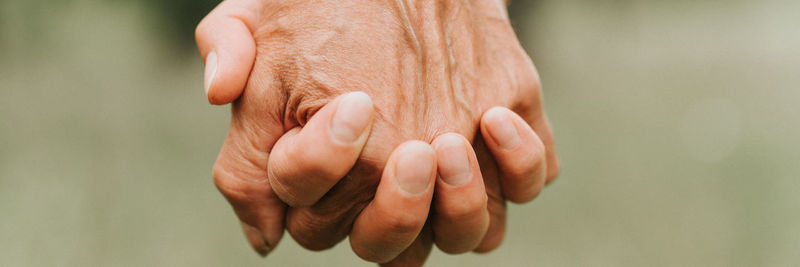 Happy senior couple holding hands. hands of man and woman hold each other. romance and love