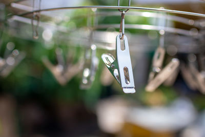 Close-up of love hanging on clothesline