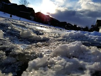 Close-up of frozen sea against sky