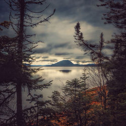 Scenic view of lake against cloudy sky