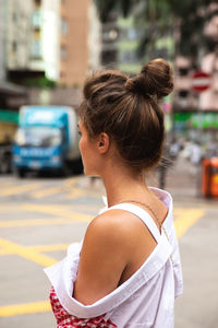 Woman looking away on street