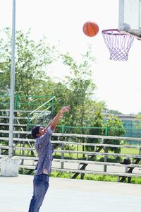 Low angle view of basketball hoop against sky