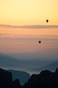 Scenic view of silhouette mountain against sky during sunset