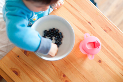 Close-up of hand on table