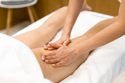 Midsection of couple kissing