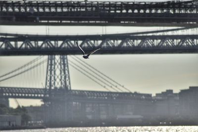 Close-up of suspension bridge over river