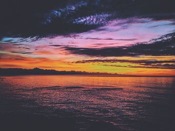 Scenic view of sea against sky at sunset