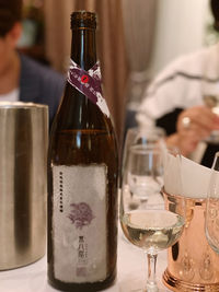 Close-up of wine bottles on table