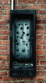 Close-up of window on brick wall