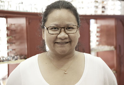 Portrait of woman wearing eyeglasses in store