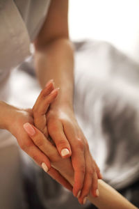 Close-up of hands massaging at spa