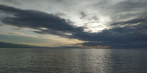 Scenic view of sea against dramatic sky