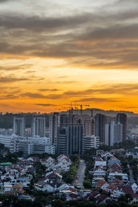 High angle view of buildings against sky during sunset