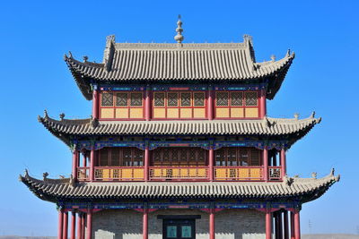 Low angle view of temple building against clear sky