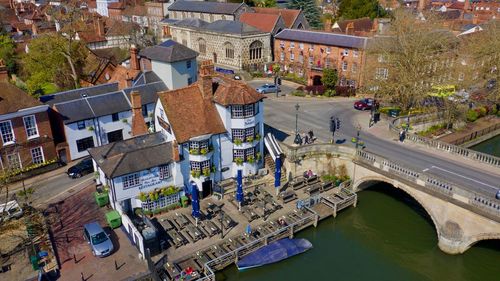 High angle view of bridge over river by buildings in city