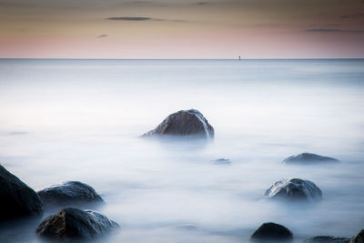 Scenic view of sea at sunset