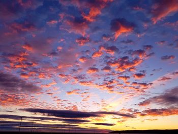 Low angle view of dramatic sky during sunset