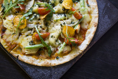 High angle view of pizza in plate on table