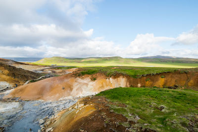 View of landscape against cloudy sky