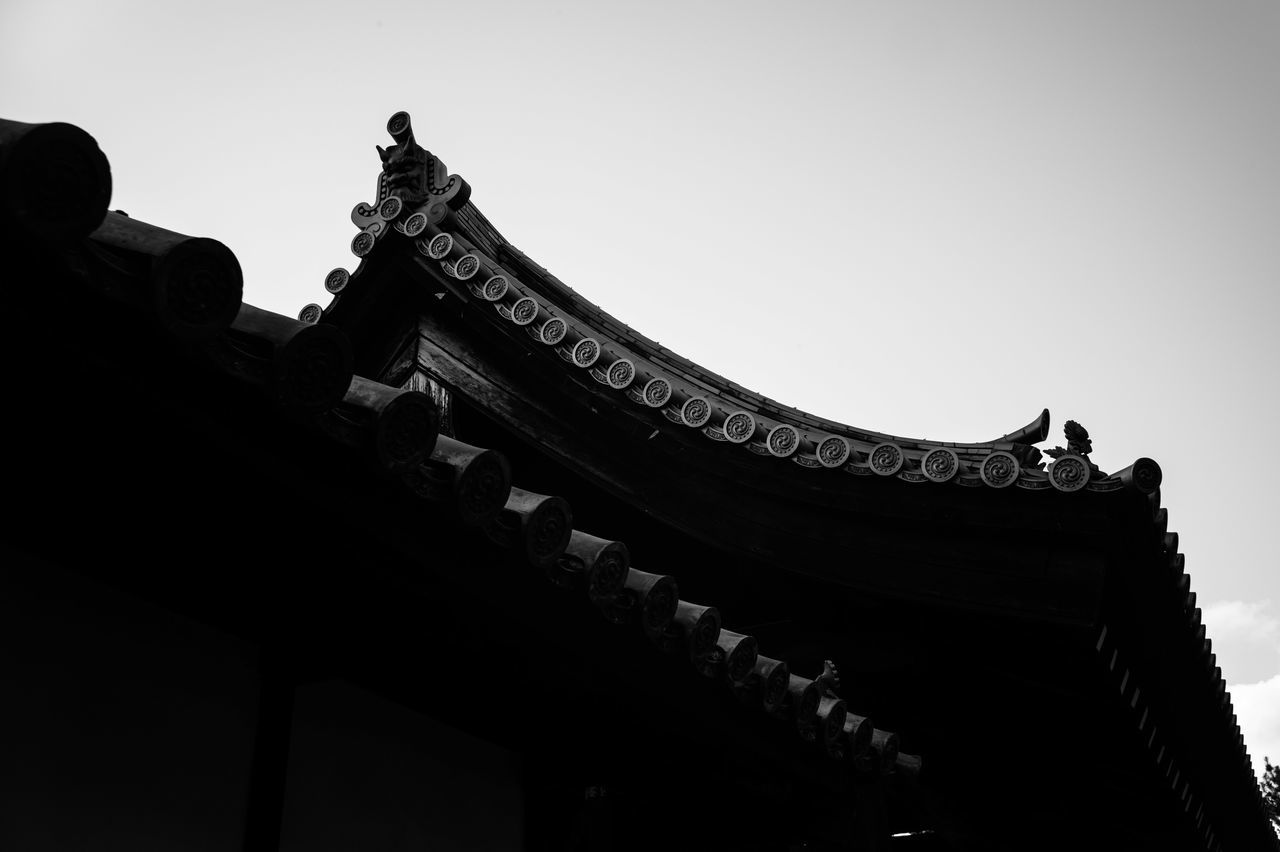 low angle view, architecture, built structure, clear sky, building exterior, place of worship, religion, temple - building, spirituality, sky, cultures, culture, copy space, tradition, famous place, outdoors, no people, history, temple