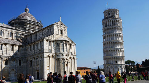 Group of people in front of historical building