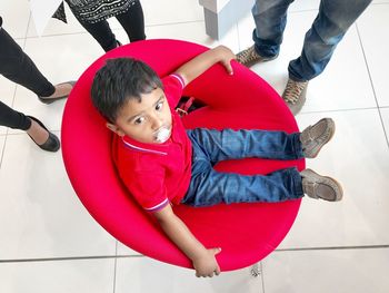 High angle view of boy playing with toy