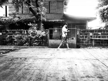 Full length of woman standing in city