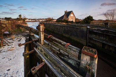 Old rusty metallic bridge against sky