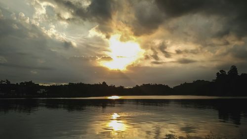 Scenic view of lake against sky during sunset