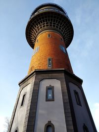 Low angle view of clock tower against sky